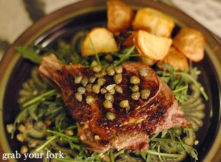 veal cutlet with capers on rocket with potatoes