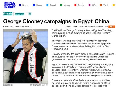 Screenshot of an article titled George Clooney campaigns in Egypt, China; accompanying photo shows Mr Clooney in a crown and a sash which says Sexiest Man Alive