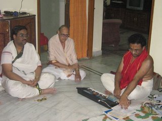 Sri Sameerana Chincholi (left) giving a discourse on Bhagavatha