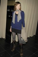 Milla Jovovich in a Miniskirt and Boots