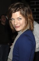 Milla Jovovich in a Miniskirt and Boots