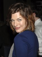Milla Jovovich in a Miniskirt and Boots
