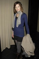 Milla Jovovich in a Miniskirt and Boots