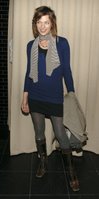 Milla Jovovich in a Miniskirt and Boots