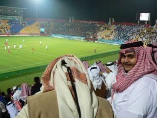 Qataris celebrate after their teams first goal