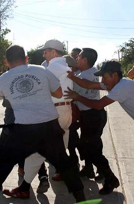 Mark in Mexico, http://markinmexico.blogspot.com/, Pale Horse Galleries for gifts, collectibles, Mexican arts and crafts, http://palehorsemex.vstore.ca/, Ixtepec, Oaxaca, Mexico: Catholic priest Father José Alejandro Solalinde Guerra shown being arrested by Ixtepec police after he lead a group of 100 angry Central American illegal immigrants to a safe house where their women had been taken. The women had supposedly been arrested by police but the priest soon learned that the women had not been taken to jail.