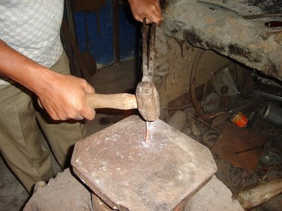 Mark in Mexico, http://markinmexico.blogspot.com/ Pale Horse Galleries for gifts, collectibles, Mexican arts and crafts, http://palehorsemex.vstore.com/ palehorsemex.blogspot.com/ Angel Aguilar pictured hammering a hand forged and tempered knife blade in Ocotlan, Oaxaca, Mexico.