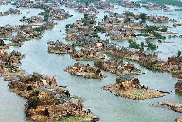 View of a Ma"dan ("Marsh Arab") floating village near Nasiriyah,  by Nik Wheeler, 1974