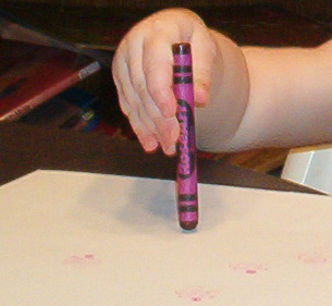 Baby writing with crayon