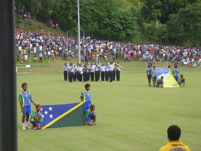 BALL BOYS WITH SOLO FLAG WITH RSIP BAND IN THE BACKGROUND
