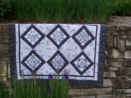 licorice twist redwork quilt- 6 pattern blocks and quilt layout.